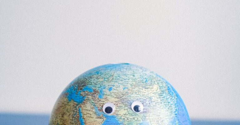 Impact - Sphere shaped miniature of Earth with googly eyes