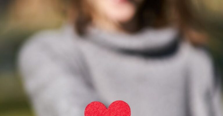 Compassion - Macro Shot Of Heart Shaped Cut Out