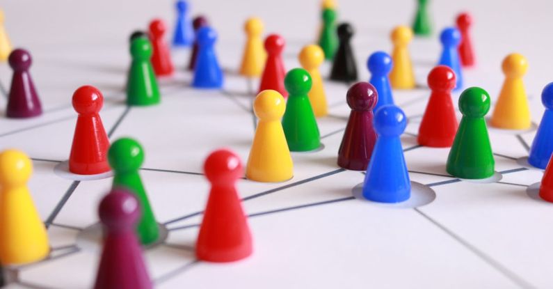 Challenges - Close Up Photography of Yellow Green Red and Brown Plastic Cones on White Lined Surface