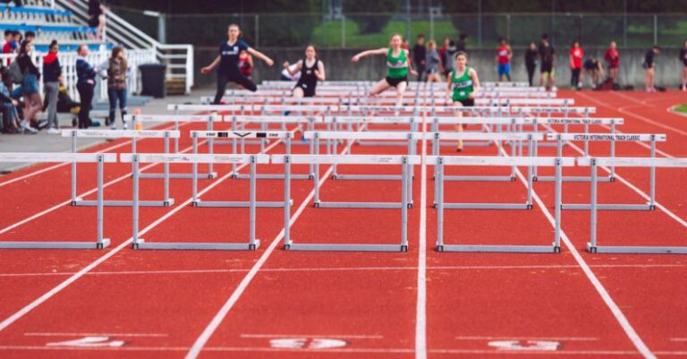 Challenges - Shallow Focus Photo of People Playing Track and Field