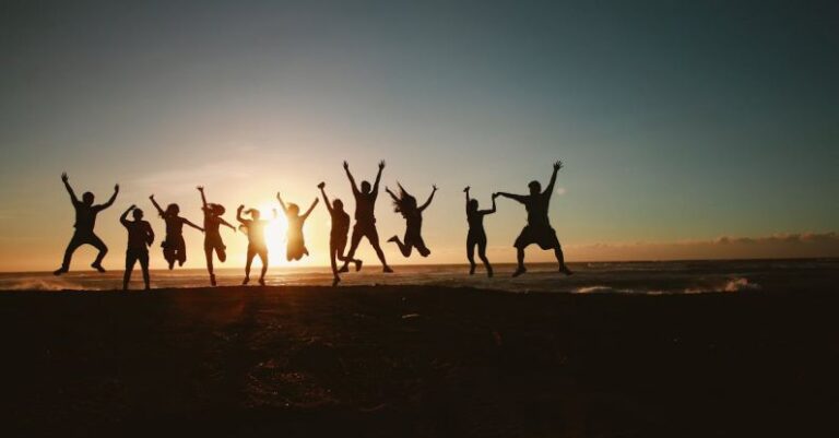 Team - Silhouette Photography of Group of People Jumping during Golden Time